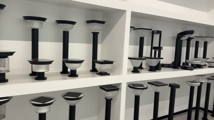 Showroom shelves displaying garden and pillar-light forms