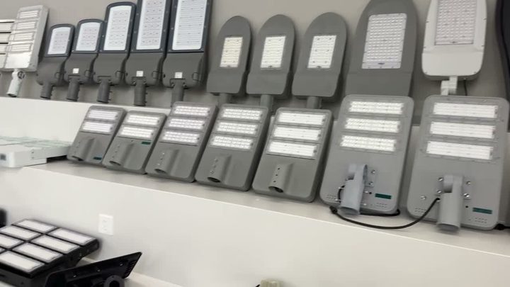 Showroom wall displaying rows of solar street-light housings